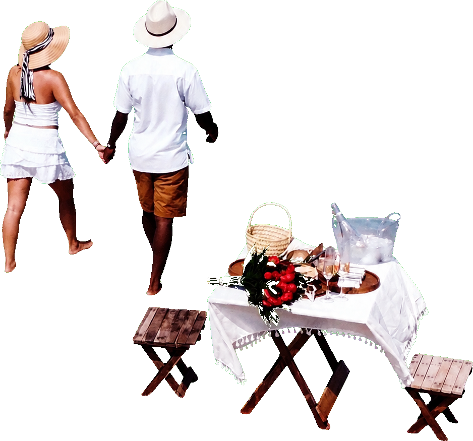 Pareja caminando hacia la mesa del picnic en el mar